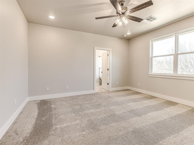 empty room with light carpet and ceiling fan