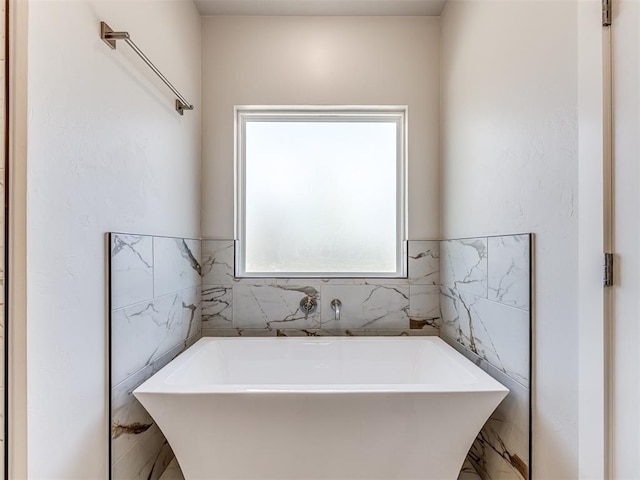 bathroom with a tub