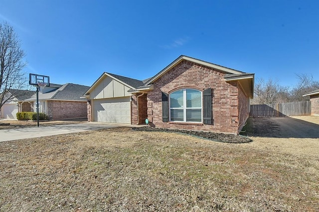 view of front of home with a garage and a front lawn