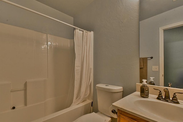 full bathroom featuring vanity, shower / bath combination with curtain, and toilet