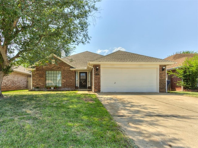 ranch-style home with a garage and a front lawn