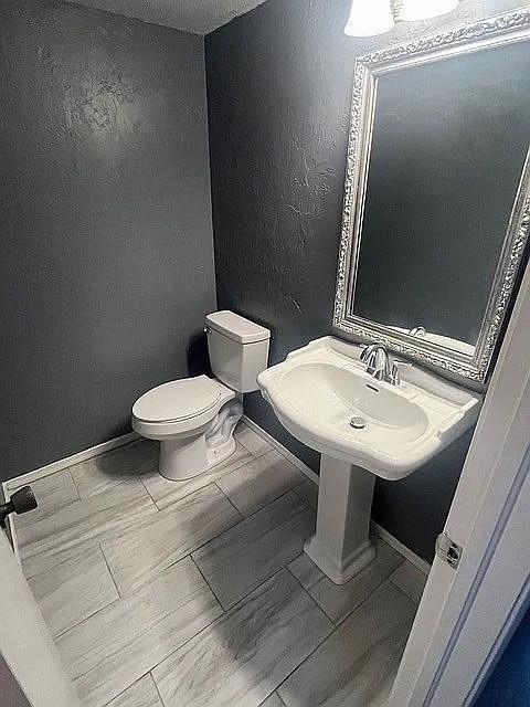 bathroom with toilet and sink