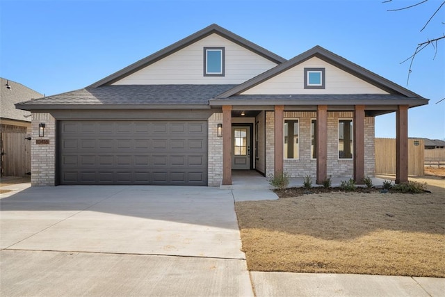 view of front of property featuring a garage and covered porch