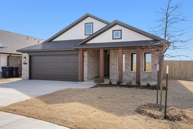 view of front of home with a garage and covered porch