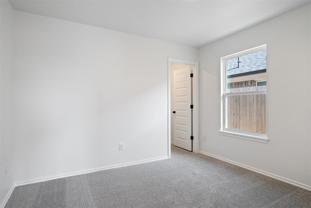 unfurnished room with carpet floors