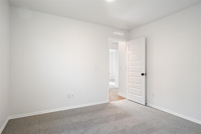 spare room with light carpet