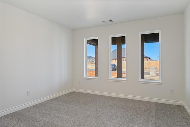 empty room featuring carpet flooring