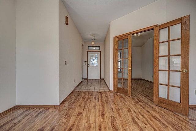 doorway featuring french doors and light wood-type flooring