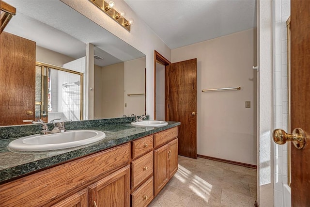 bathroom with vanity and an enclosed shower