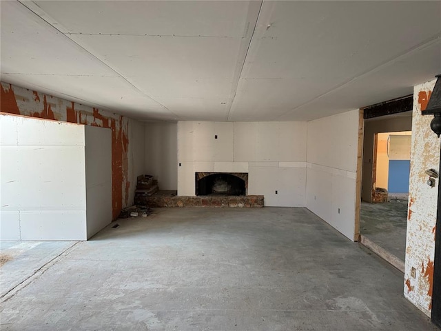 unfurnished living room featuring concrete floors