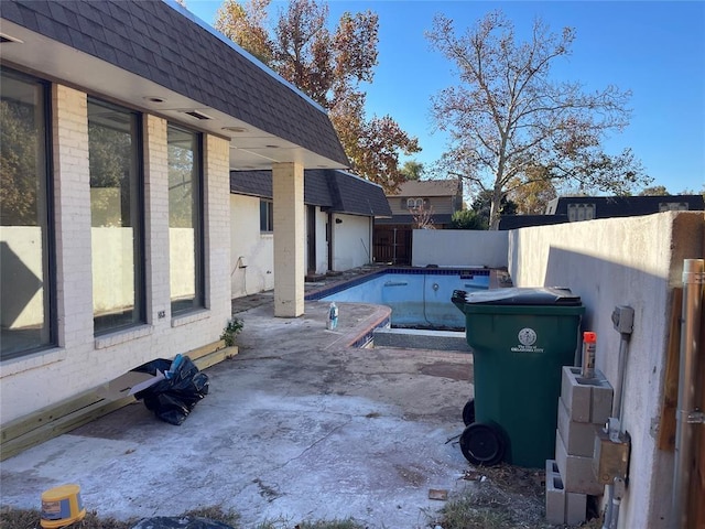 view of patio featuring a fenced in pool