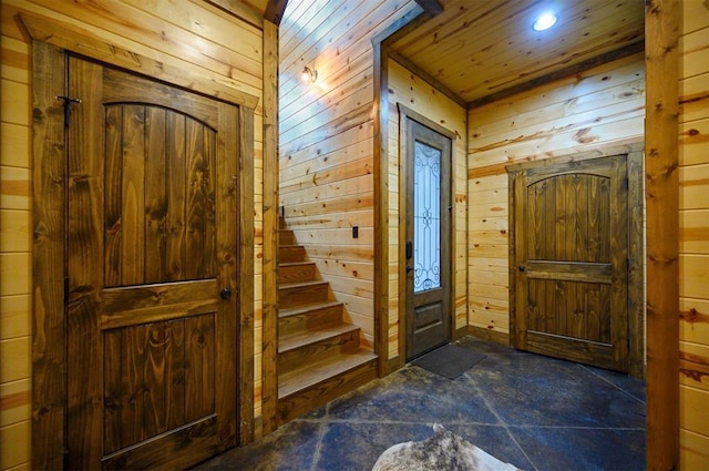 foyer entrance with wood walls