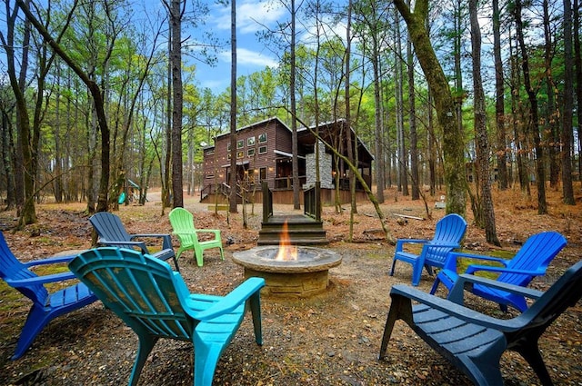 exterior space featuring an outdoor fire pit