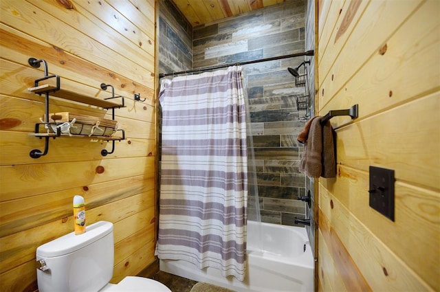 bathroom with shower / tub combo with curtain, toilet, and wood walls