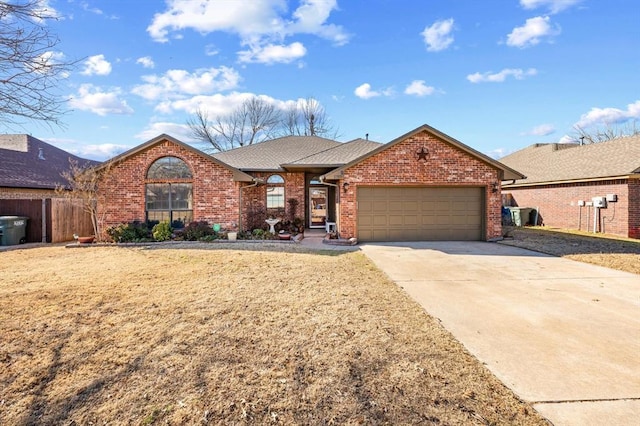 view of front of house featuring a garage and a front yard