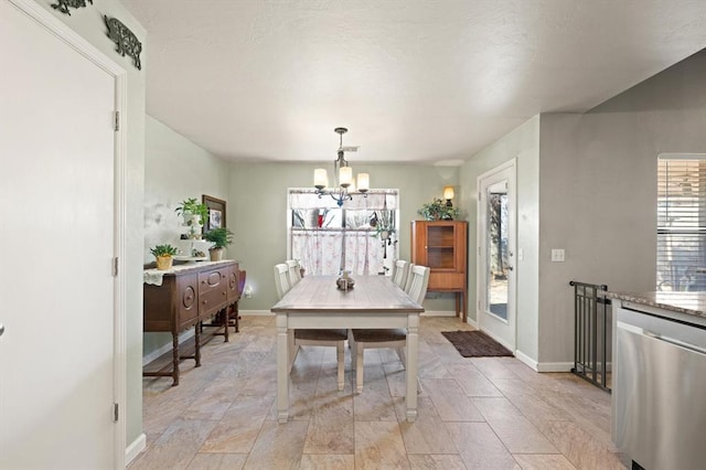 dining area featuring an inviting chandelier