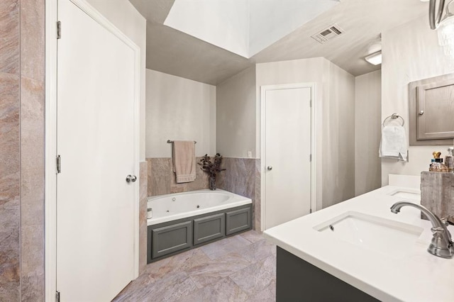 bathroom featuring vanity and a bathtub