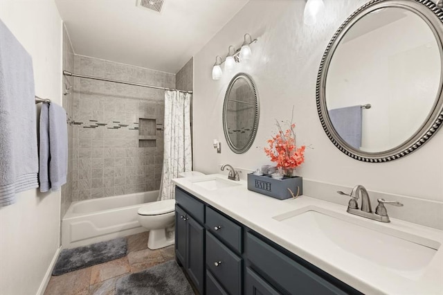 full bathroom featuring shower / tub combo with curtain, vanity, and toilet