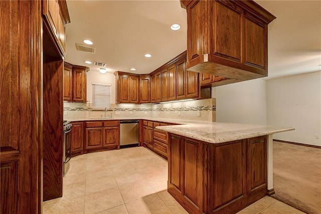 kitchen with kitchen peninsula, appliances with stainless steel finishes, backsplash, light stone countertops, and light tile patterned flooring