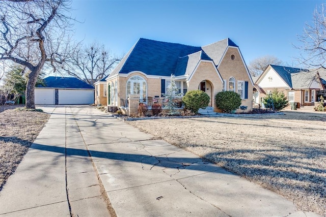 view of front of property with an outbuilding and a garage