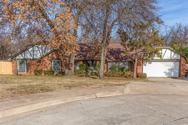 view of front facade featuring a garage and a front yard