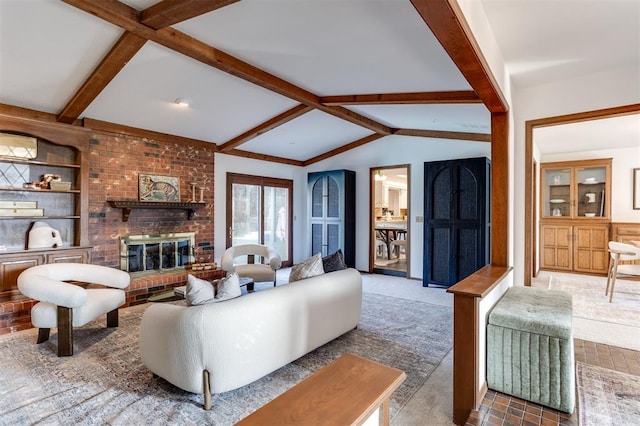 living room with lofted ceiling with beams, a fireplace, and built in shelves