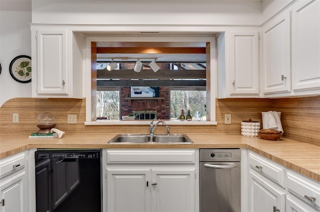 kitchen with sink, white cabinetry, black dishwasher, a wealth of natural light, and backsplash