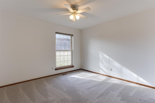 carpeted empty room with ceiling fan