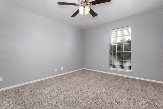 empty room with ceiling fan and carpet flooring