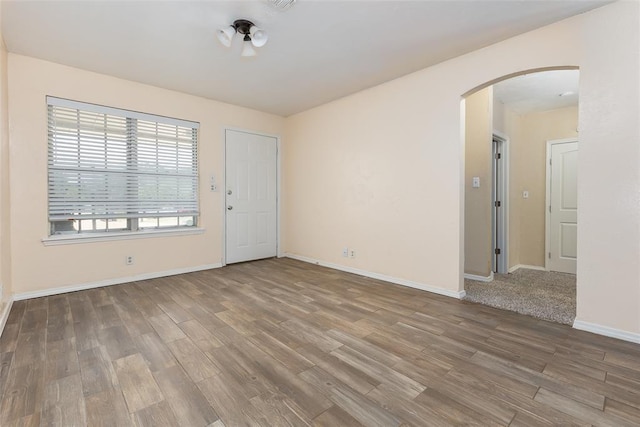 spare room with hardwood / wood-style flooring