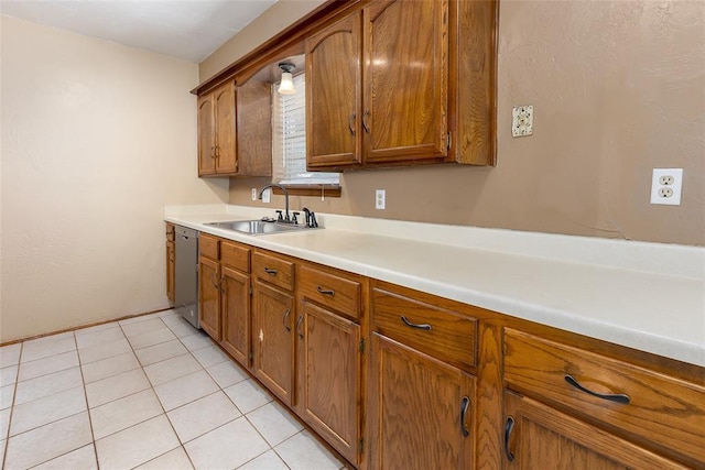 kitchen with sink, light tile patterned floors, and dishwasher