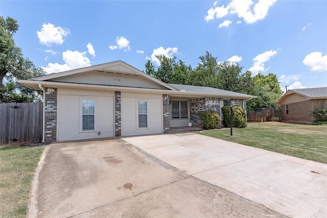 ranch-style home with a front lawn