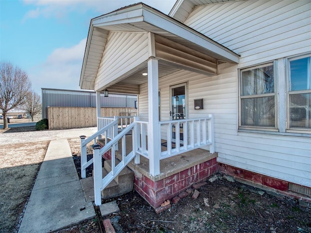 property entrance featuring covered porch