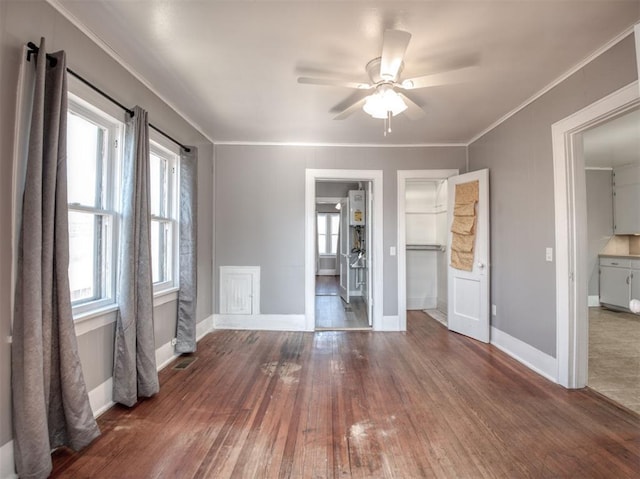 interior space with crown molding, hardwood / wood-style floors, and ceiling fan