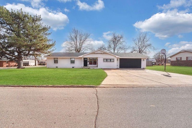 ranch-style house with a garage and a front lawn