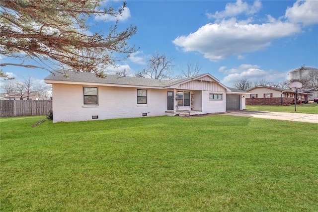 view of front of home featuring a garage and a front lawn