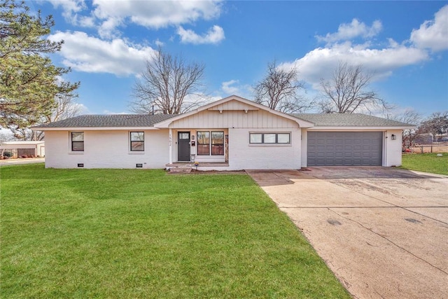 ranch-style home with a garage and a front lawn