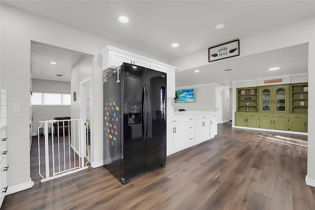 kitchen featuring white cabinetry, dark hardwood / wood-style flooring, and black refrigerator with ice dispenser