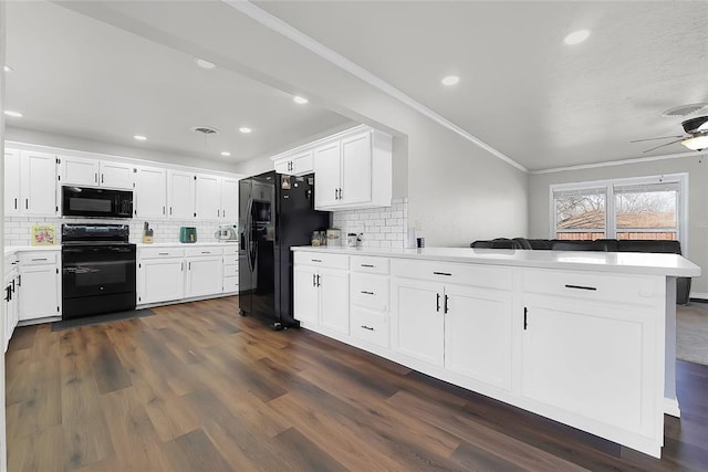 kitchen featuring kitchen peninsula, white cabinets, and black appliances