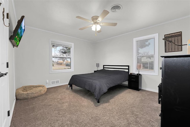 carpeted bedroom with multiple windows, crown molding, and ceiling fan