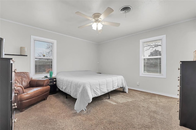 bedroom featuring crown molding, light colored carpet, and ceiling fan