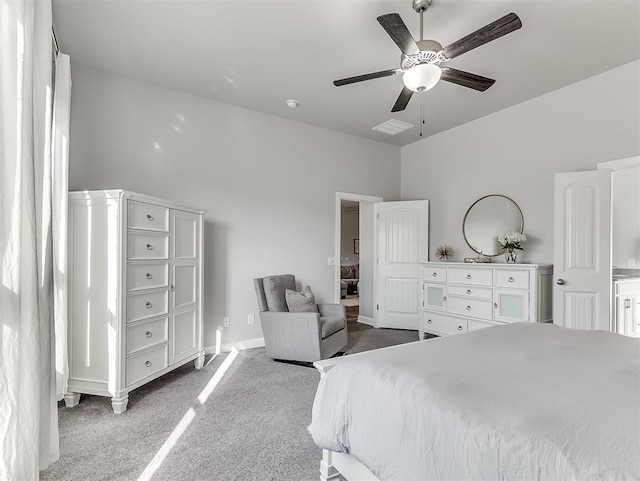 bedroom featuring light carpet and ceiling fan