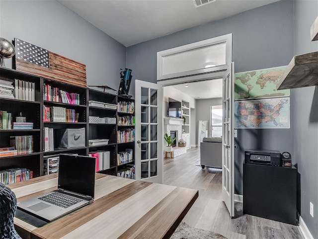 office area with light wood-type flooring