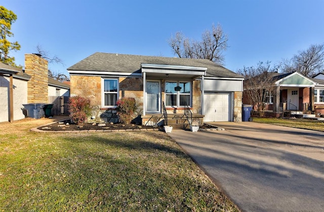 view of front of house featuring a garage and a front yard