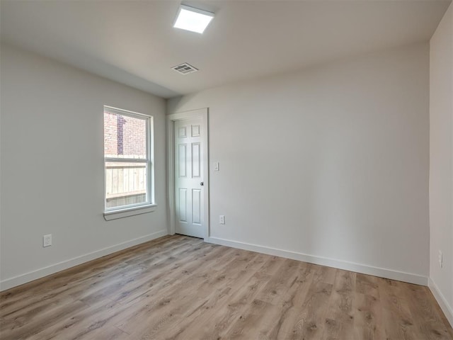 unfurnished room featuring light hardwood / wood-style floors