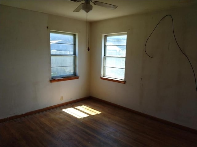 unfurnished room featuring dark hardwood / wood-style floors and ceiling fan