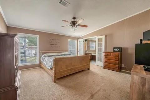 bedroom with ceiling fan, french doors, light colored carpet, ornamental molding, and lofted ceiling