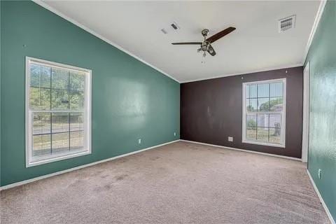 carpeted empty room with vaulted ceiling and ceiling fan