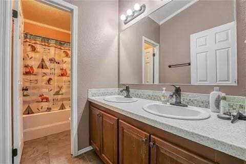 bathroom with tile patterned floors, vanity, and shower / bath combo