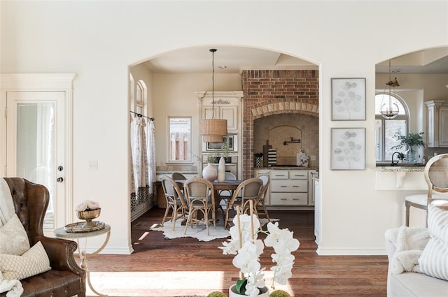 dining area featuring dark hardwood / wood-style flooring and sink